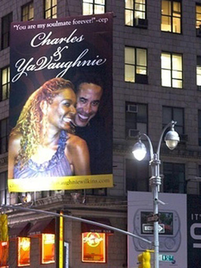 A billboard revealing a shocking extramarital affair. 